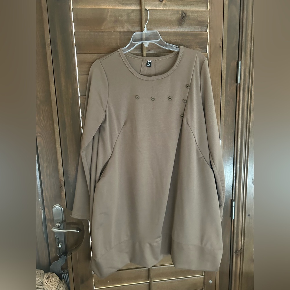 Unique Tunic with Asymmetrical Angles and Pockets.